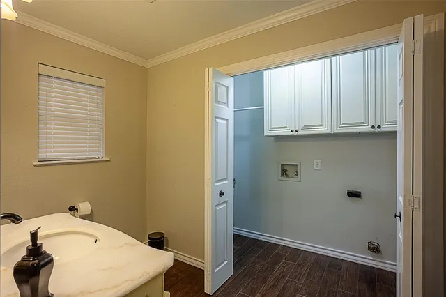 a bathroom with a sink a toilet and vanity