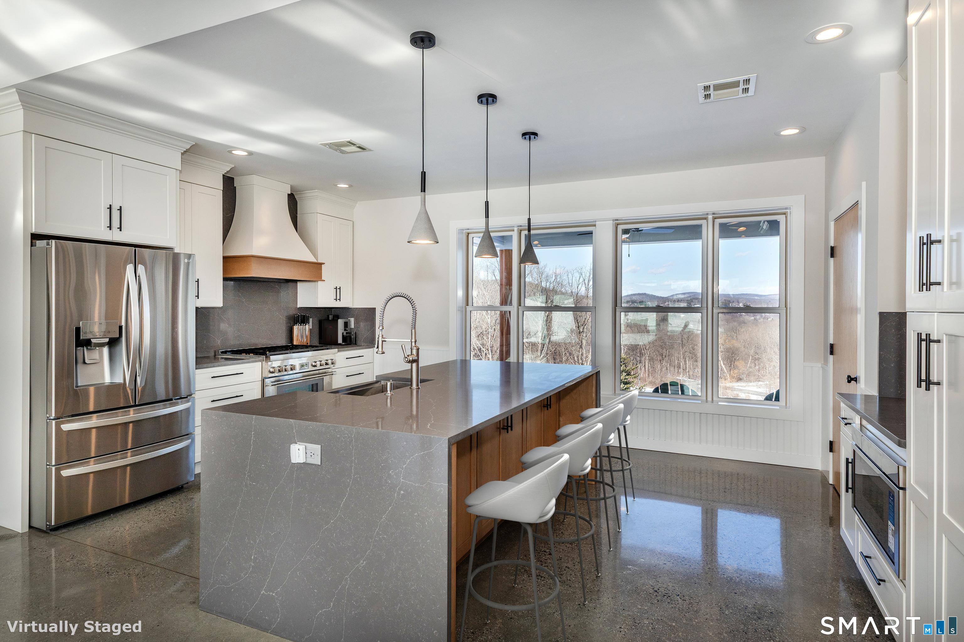 105 Highway 39 Sherman, CT 06784 - Photo 13 of 39 a kitchen with kitchen island a large counter top space a sink stainless steel appliances and cabinets