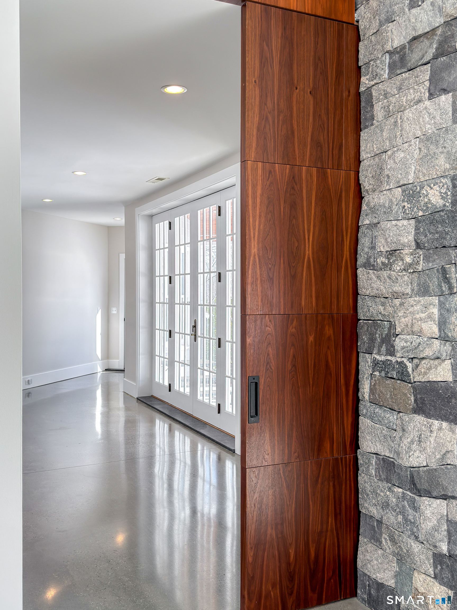 105 Highway 39 Sherman, CT 06784 - Photo 22 of 39 a view of an empty room with wooden floor and a window