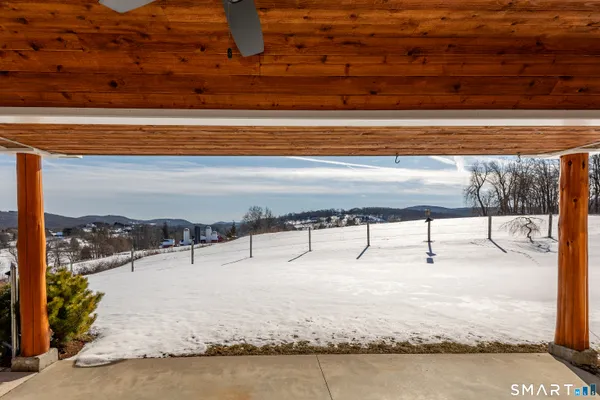 a view of a backyard with iron fence