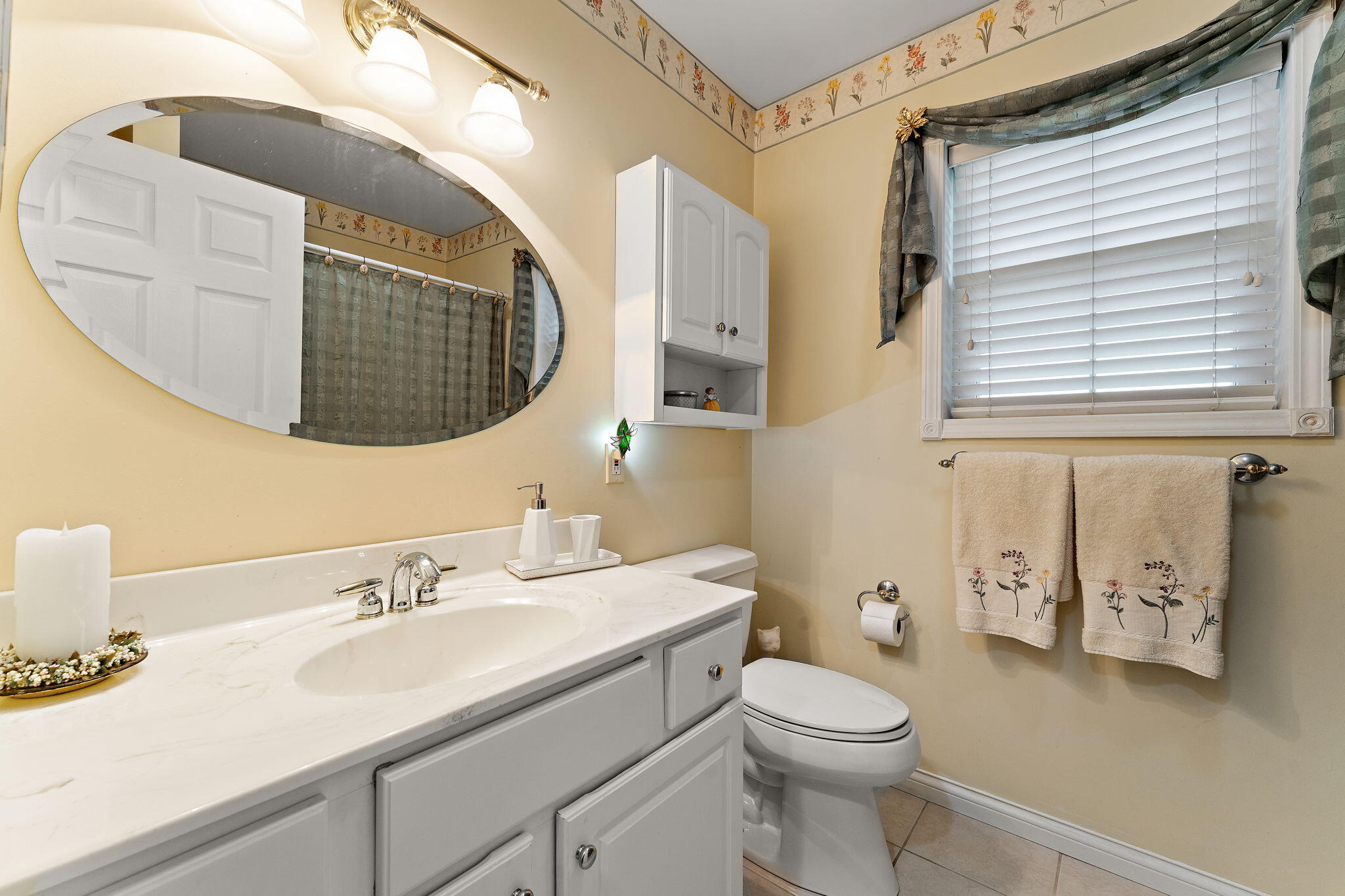 3431 Drivers Way Chesterton, IN 46304 - Photo 16 of 31 a bathroom with a toilet a sink and mirror