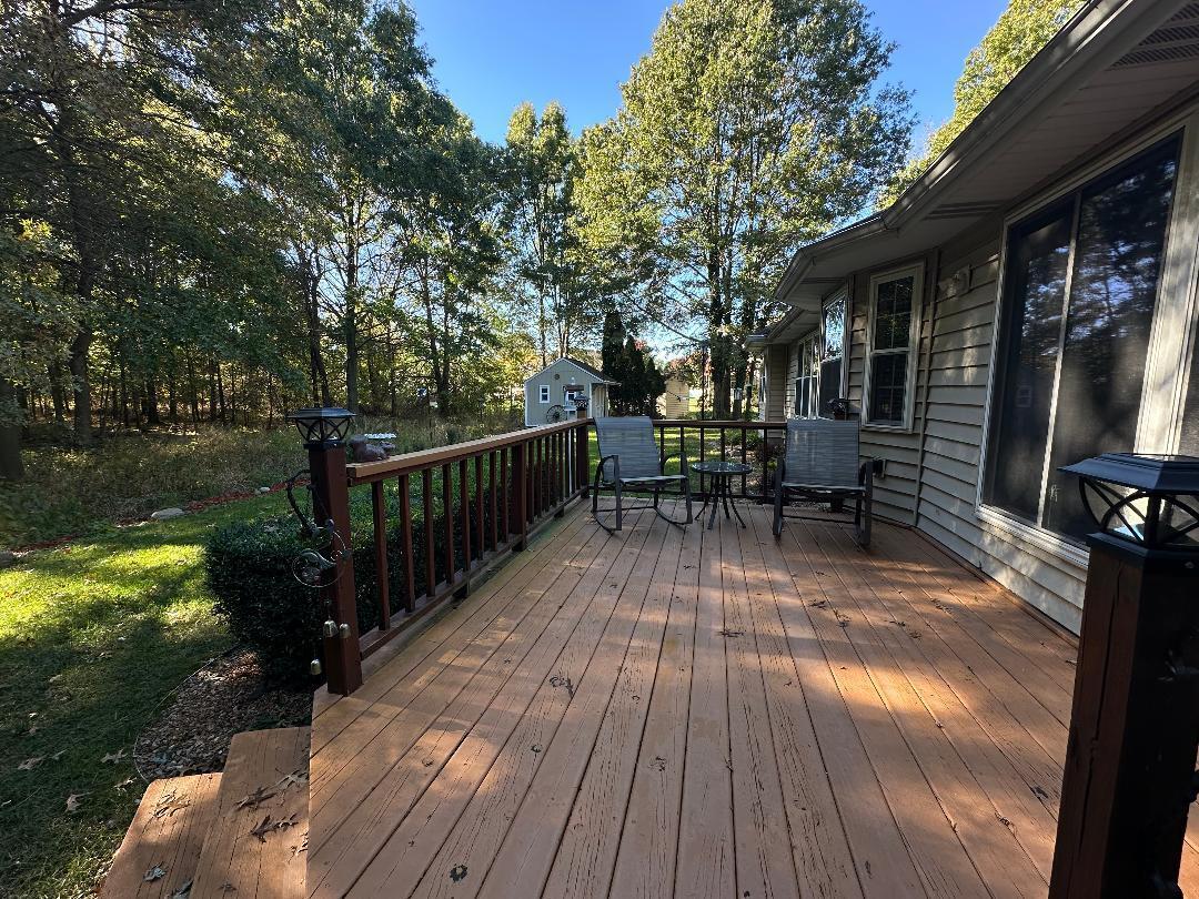 3431 Drivers Way Chesterton, IN 46304 - Photo 18 of 31 a view of balcony with furniture and wooden floor