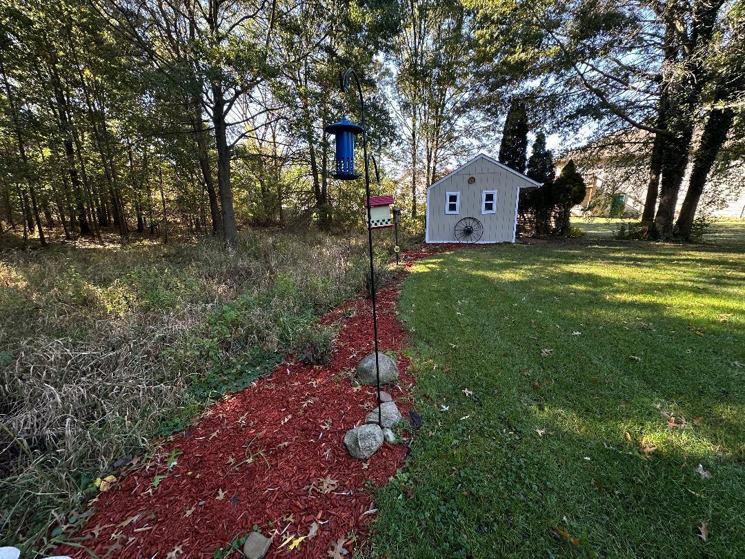 3431 Drivers Way Chesterton, IN 46304 - Photo 26 of 31 a front view of a house with a yard and garage