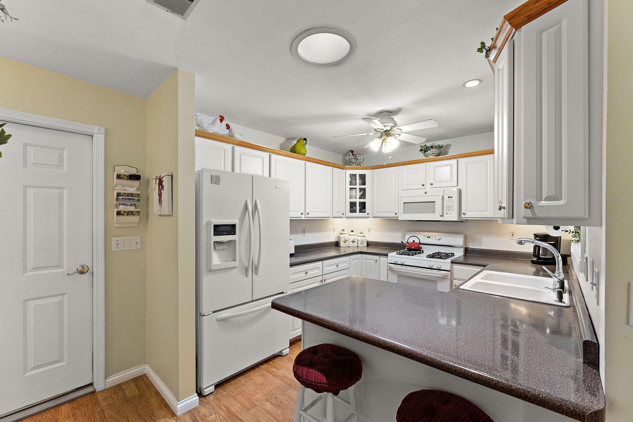 3431 Drivers Way Chesterton, IN 46304 - Photo 9 of 31 a kitchen with a refrigerator a sink and cabinets