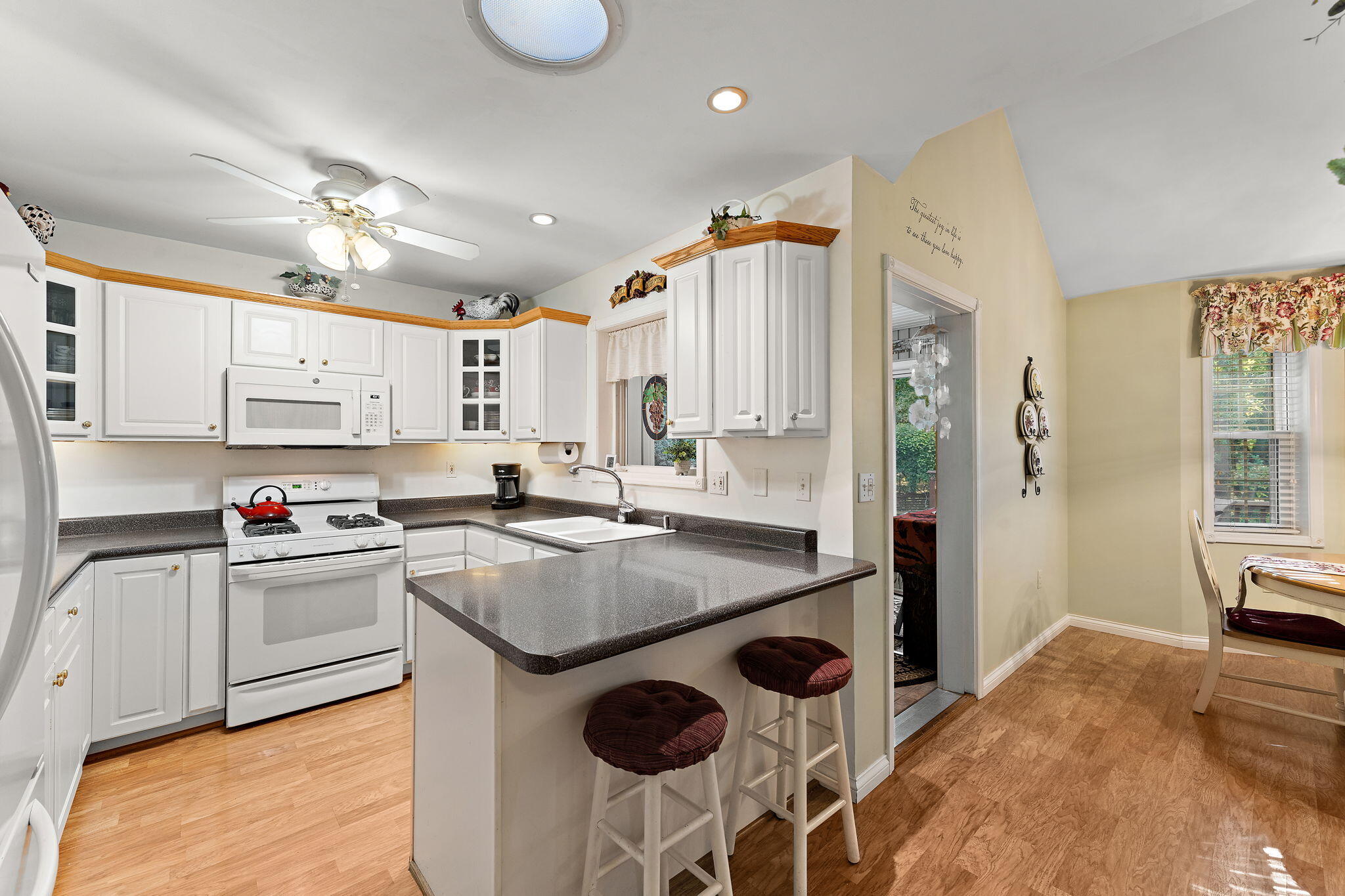 3431 Drivers Way Chesterton, IN 46304 - Photo 10 of 31 a kitchen with stainless steel appliances granite countertop a sink a stove and a refrigerator