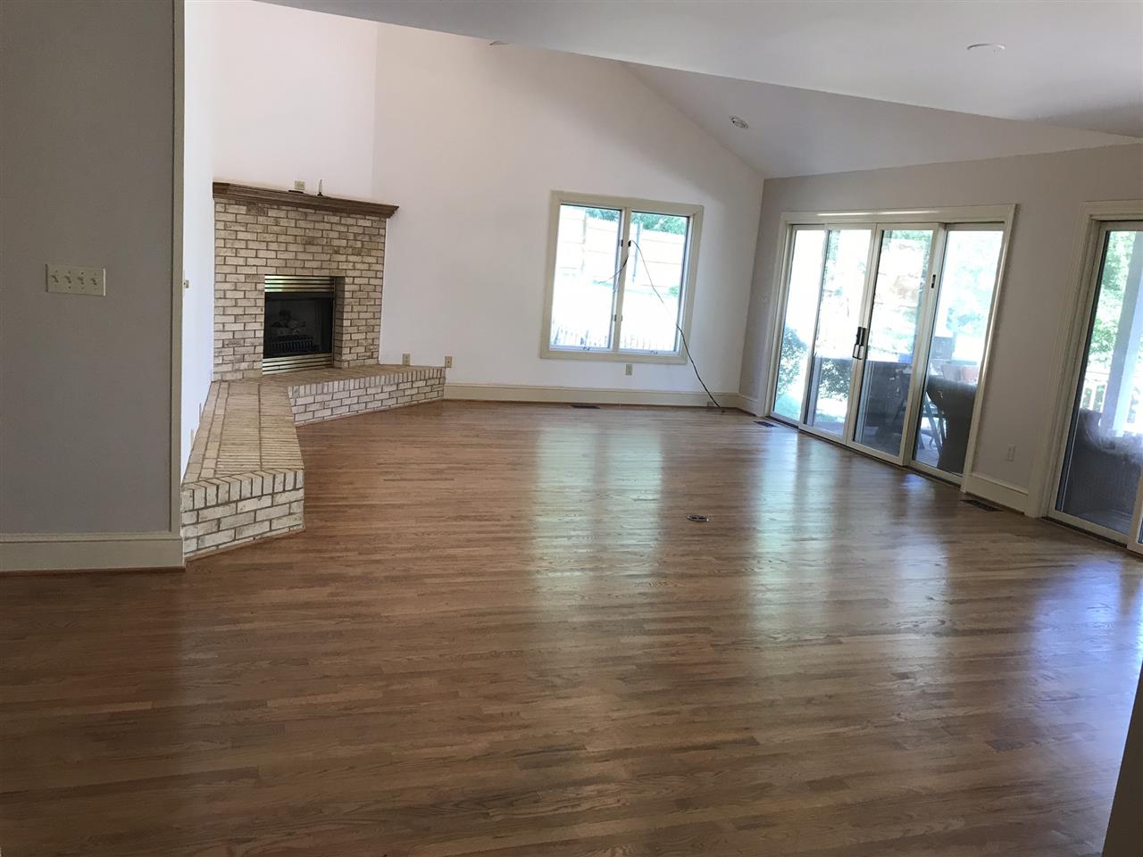 15 Lilly Farm Lane Raphine, VA 24472 - Photo 3 of 49 an empty room with wooden floor and windows