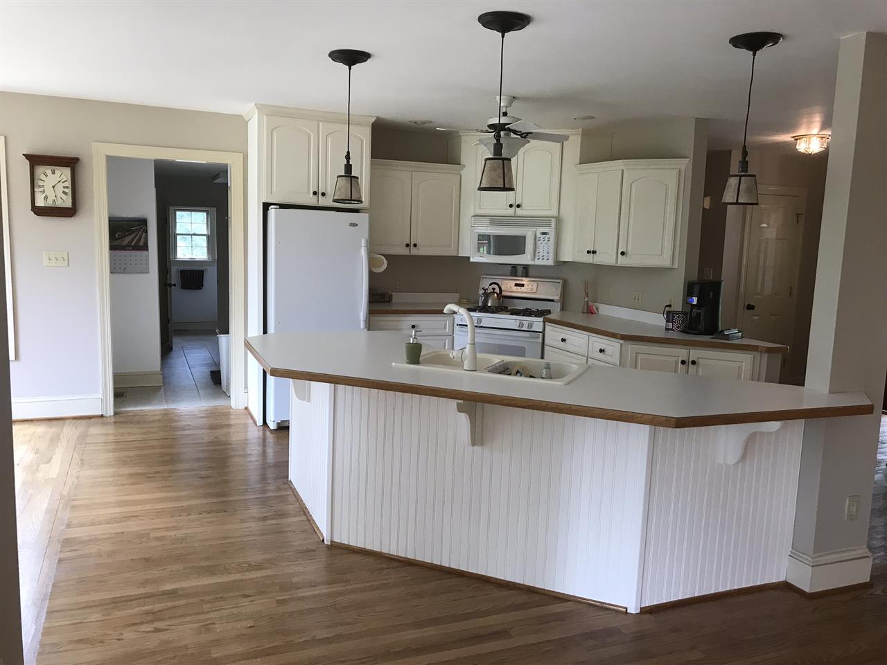 15 Lilly Farm Lane Raphine, VA 24472 - Photo 4 of 49 a kitchen with stainless steel appliances granite countertop a sink a refrigerator and a stove