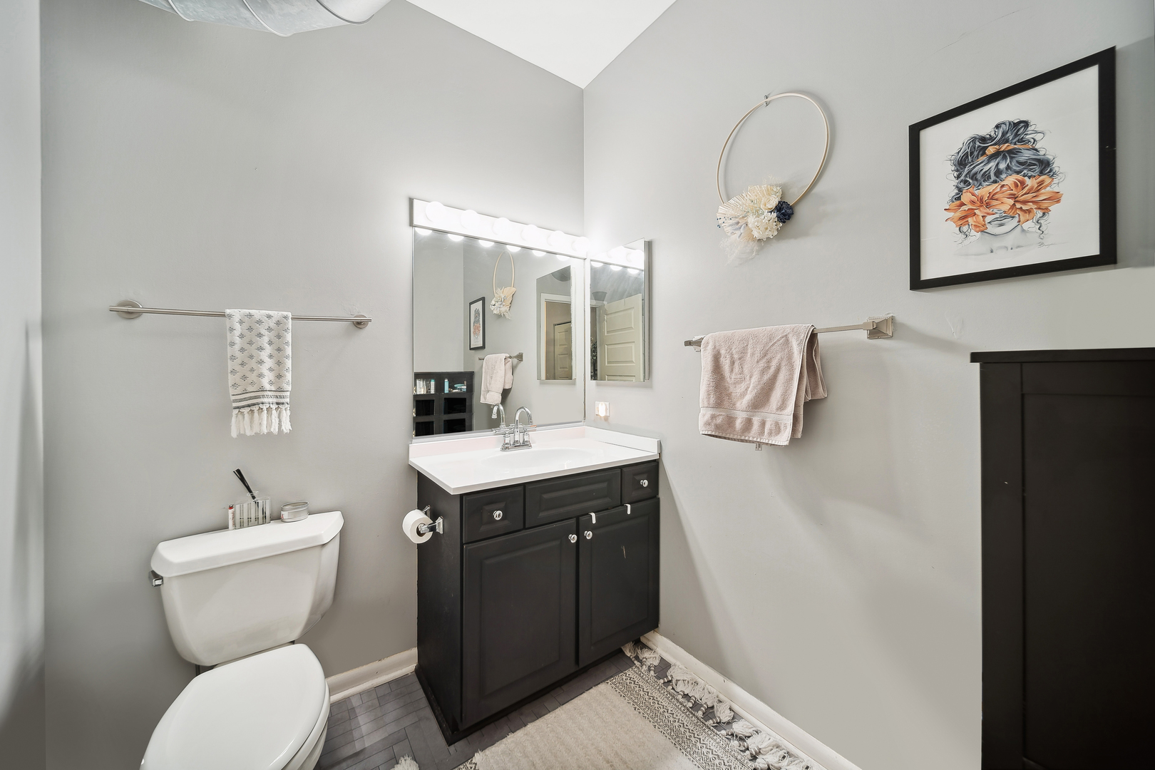1200 West Monroe Street, Unit 418 Chicago, IL 60607 - Photo 13 of 17 a bathroom with a toilet sink and mirror