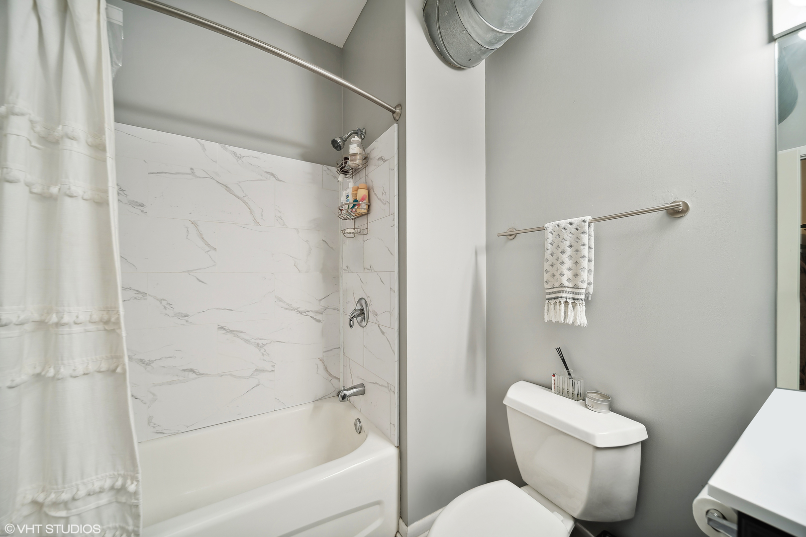 1200 West Monroe Street, Unit 418 Chicago, IL 60607 - Photo 14 of 17 a white toilet sitting next to a bath tub