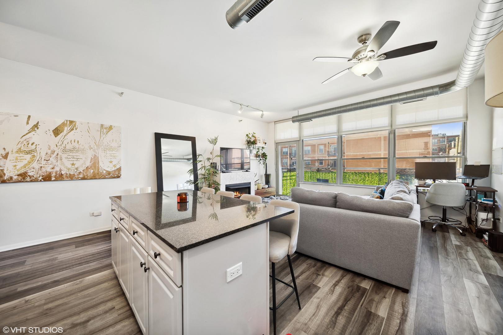 1200 West Monroe Street, Unit 418 Chicago, IL 60607 - Photo 6 of 17 a living room with furniture and a large window