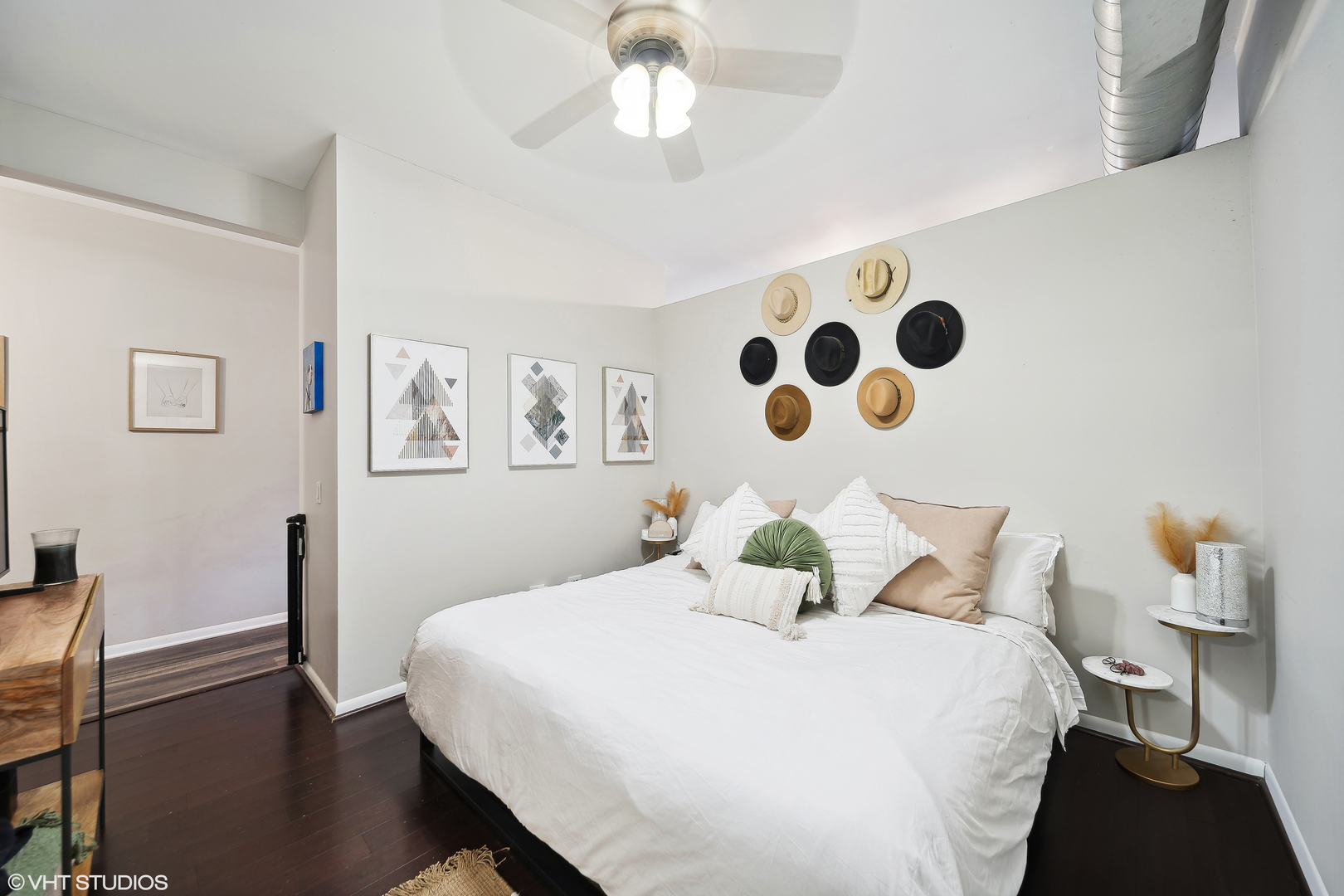 1200 West Monroe Street, Unit 418 Chicago, IL 60607 - Photo 10 of 17 a bedroom with a bed and wooden floor