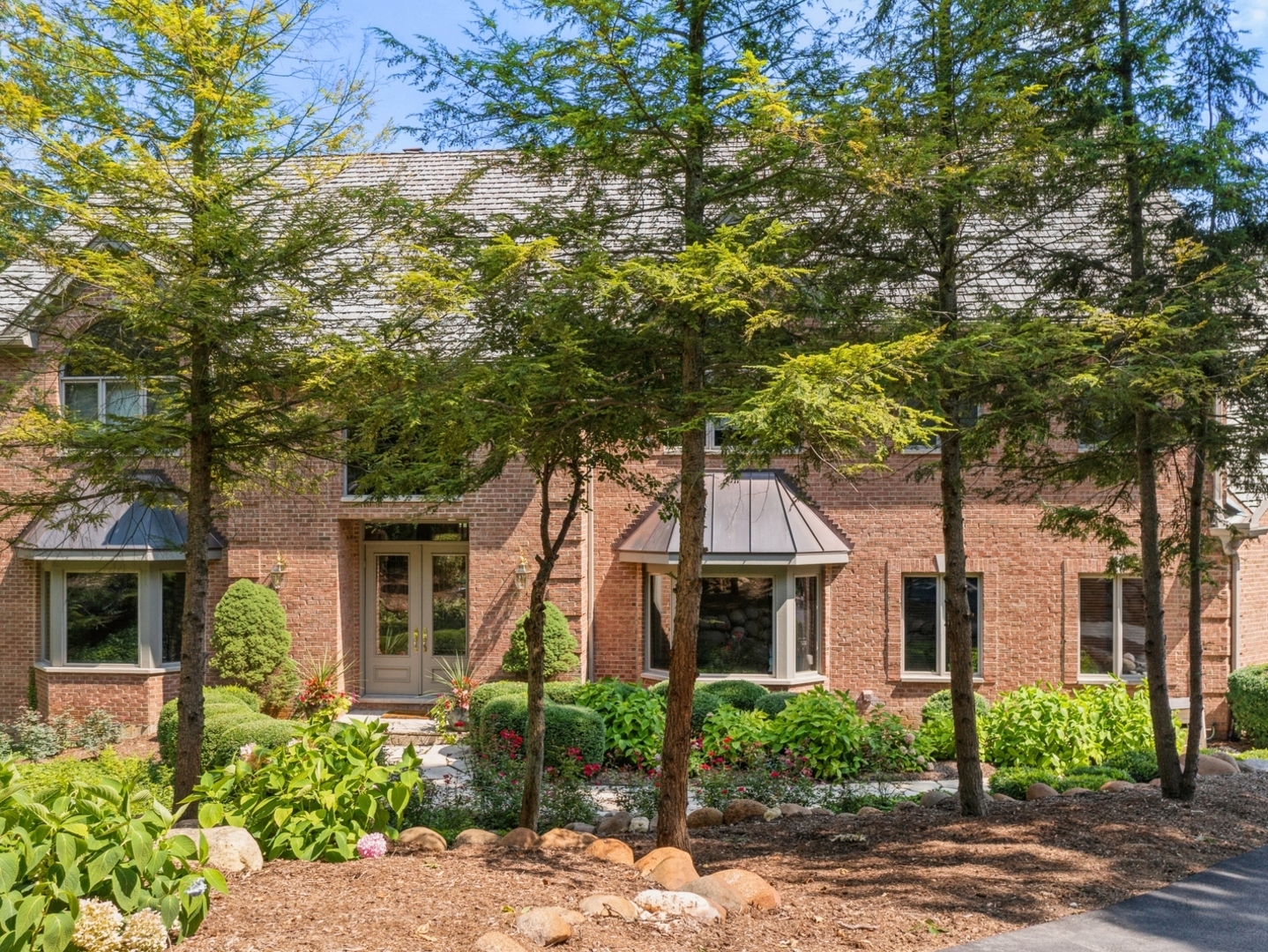 33 Brinker Road Barrington Hills, IL 60010 - Photo 38 of 43 front view of a house with a tree