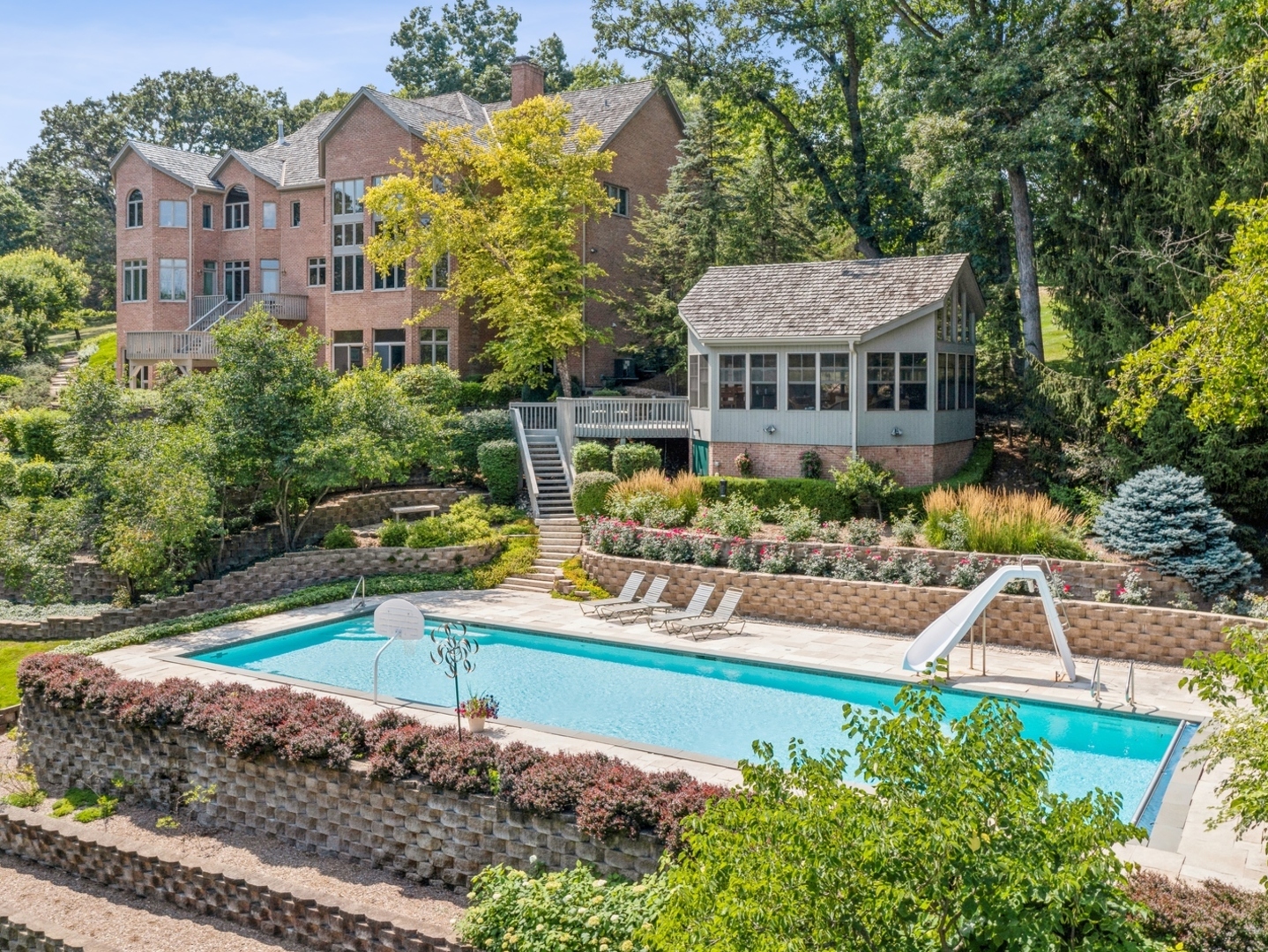 33 Brinker Road Barrington Hills, IL 60010 - Photo 43 of 43 a front view of a house with a yard table and chairs
