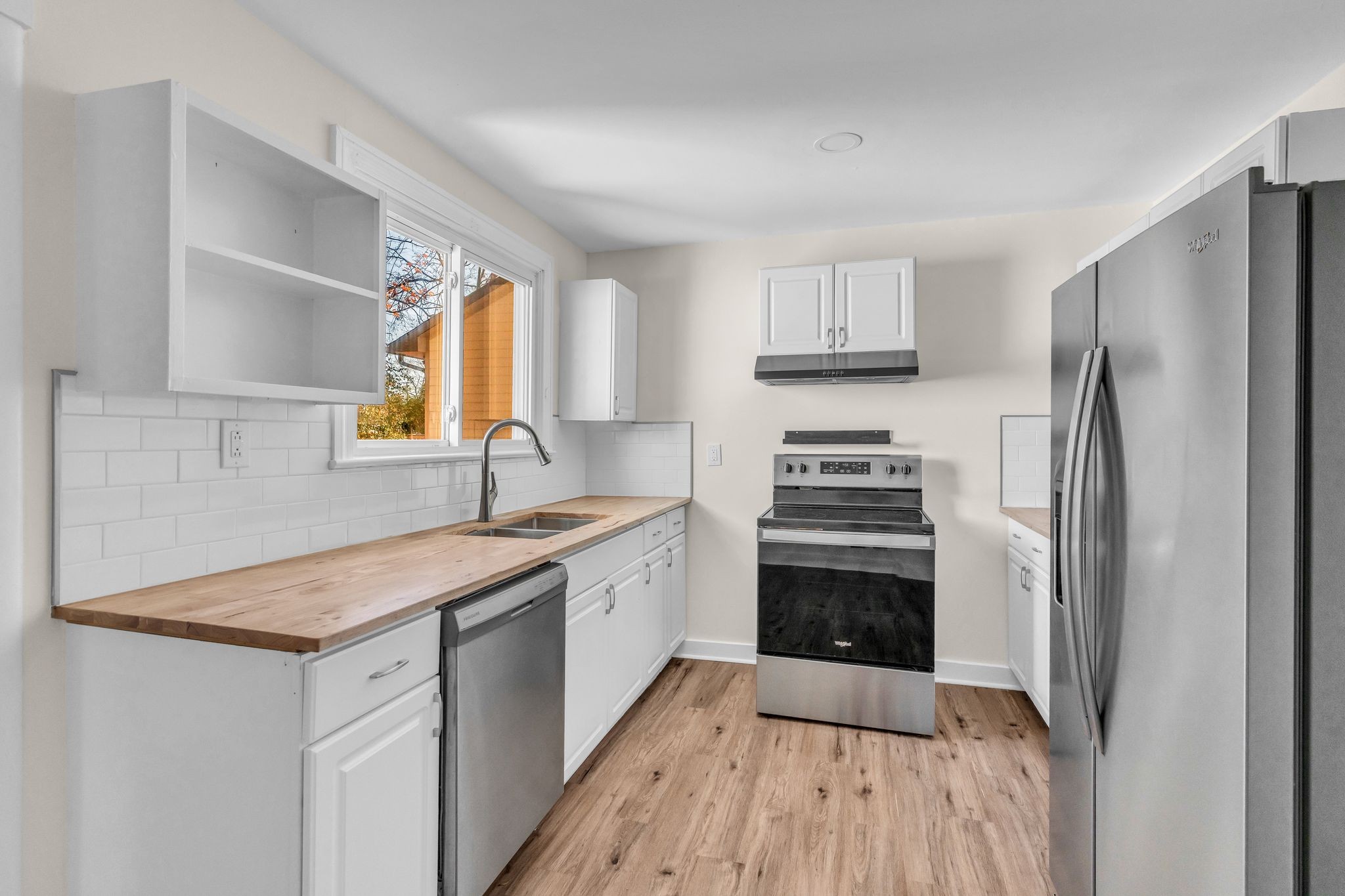 126 Eagan Circle Madison, TN 37115 - Photo 12 of 28 a kitchen with a sink stove and refrigerator