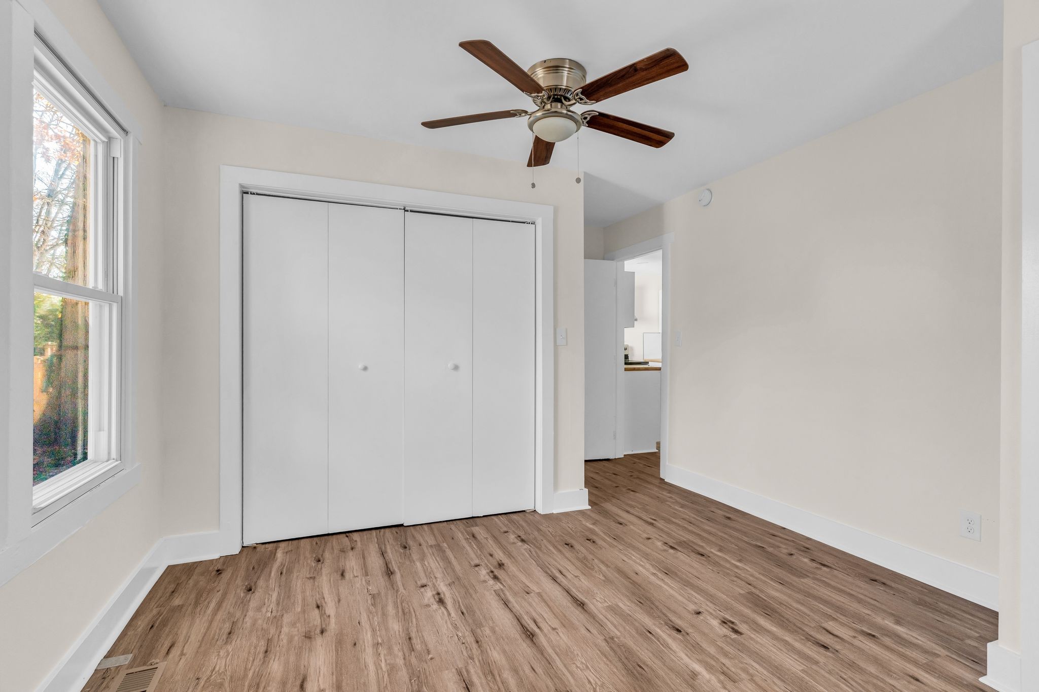 126 Eagan Circle Madison, TN 37115 - Photo 14 of 28 wooden floor in an empty room with a window