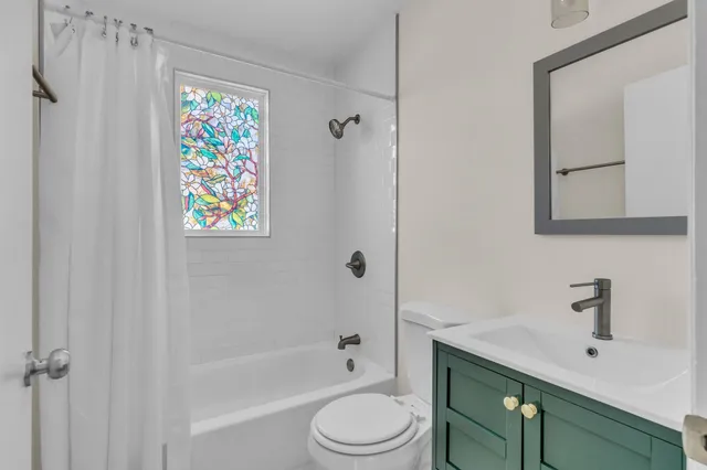 a bathroom with a sink a toilet and a bathtub