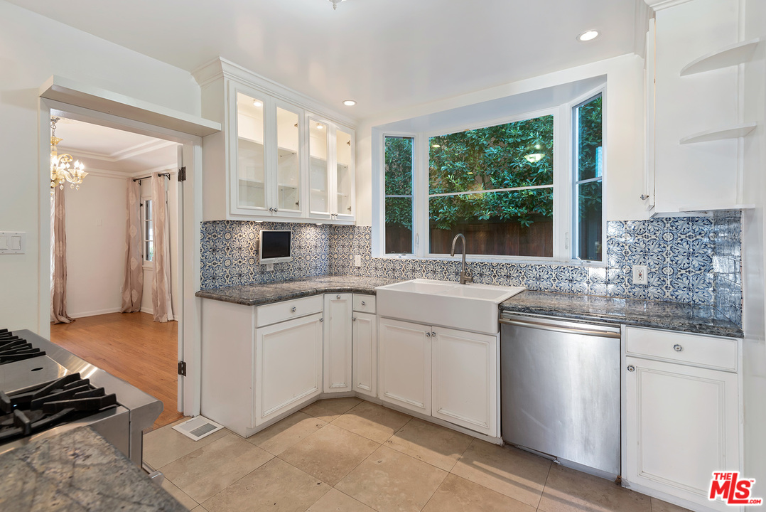357 South La Peer Drive Beverly Hills, CA 90211 - Photo 12 of 31 a kitchen with stainless steel appliances granite countertop a sink stove and refrigerator
