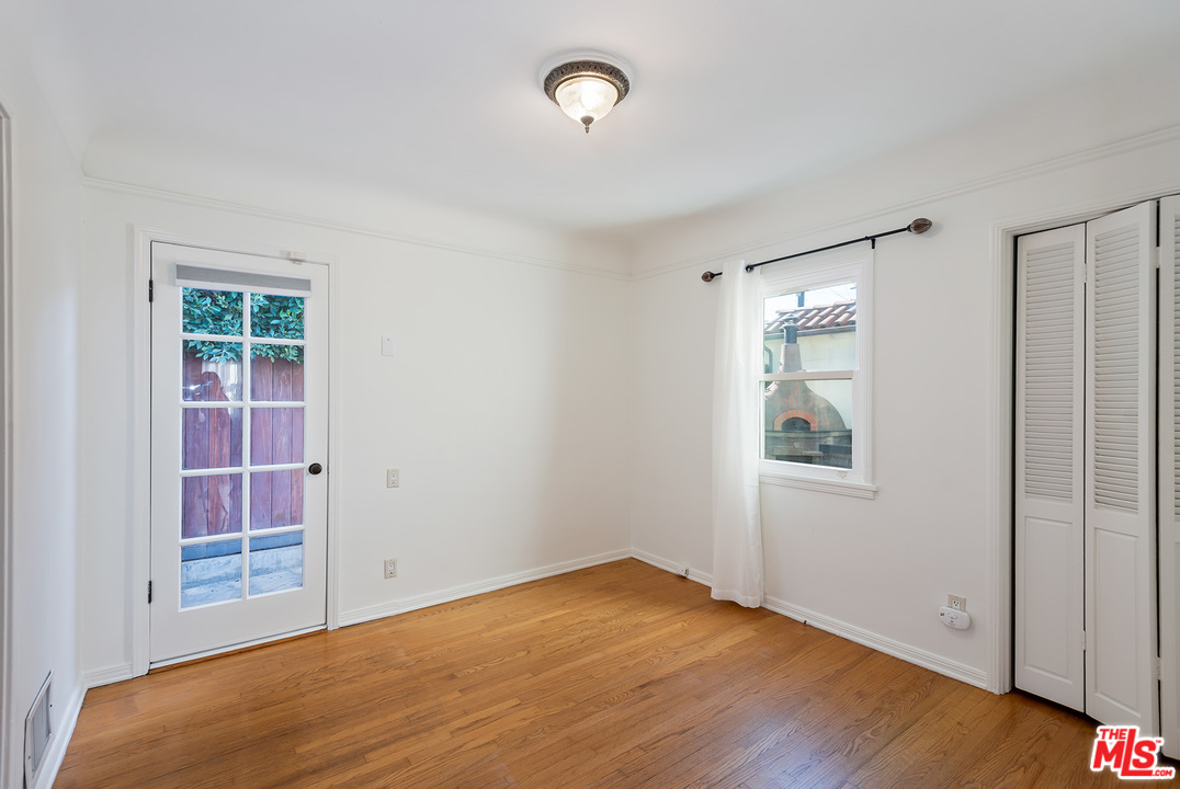 357 South La Peer Drive Beverly Hills, CA 90211 - Photo 15 of 31 an empty room with windows