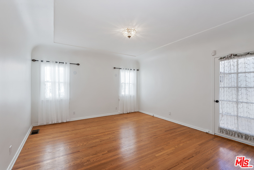 357 South La Peer Drive Beverly Hills, CA 90211 - Photo 19 of 31 a view of empty room with wooden floor and fan