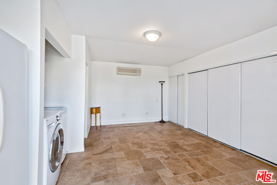 357 South La Peer Drive Beverly Hills, CA 90211 - Photo 29 of 31 a view of a storage & utility room with a washer dryer