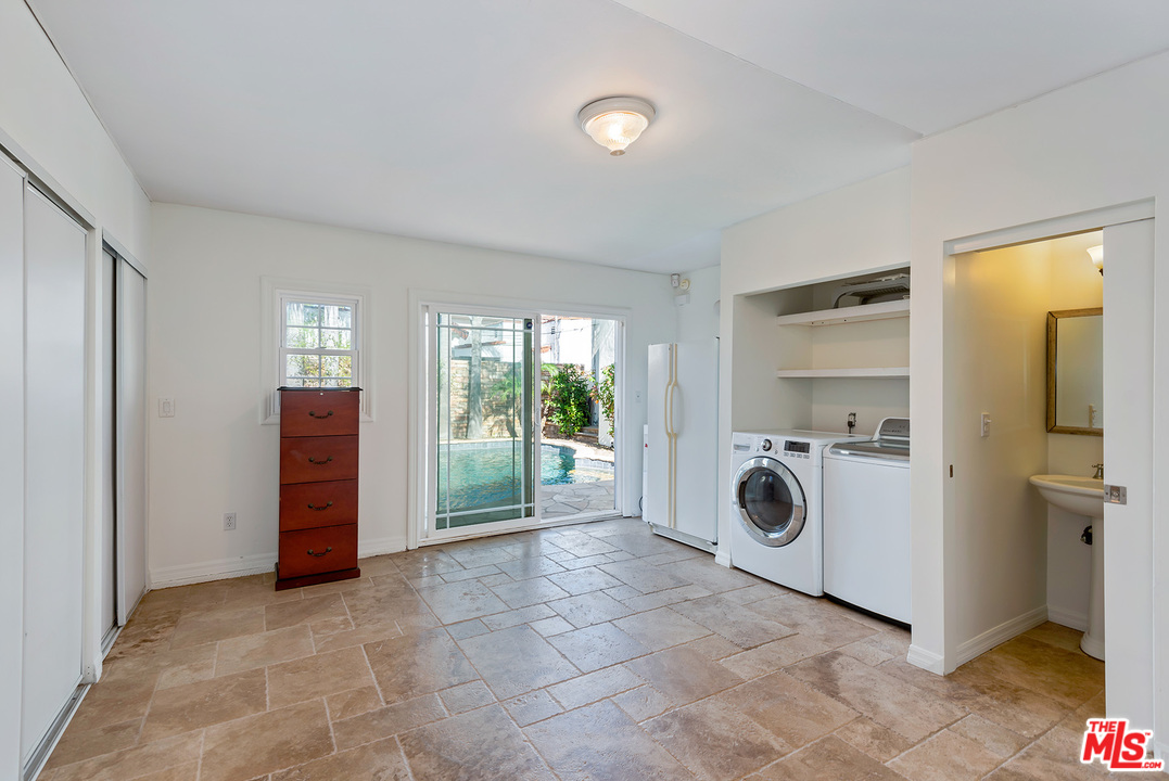357 South La Peer Drive Beverly Hills, CA 90211 - Photo 30 of 31 a view of a storage & utility room with washer and dryer