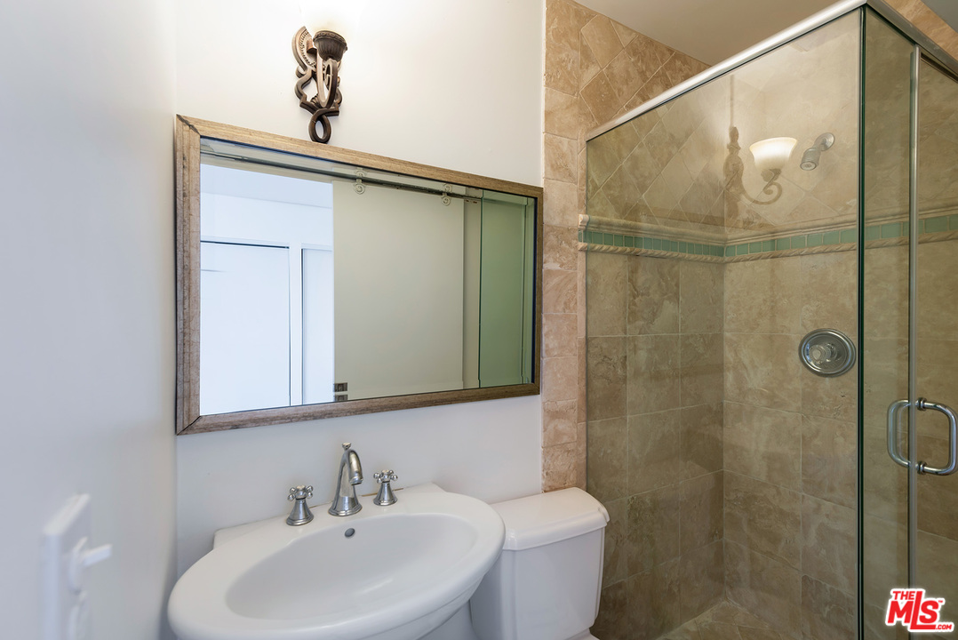 357 South La Peer Drive Beverly Hills, CA 90211 - Photo 31 of 31 a bathroom with a sink and mirror