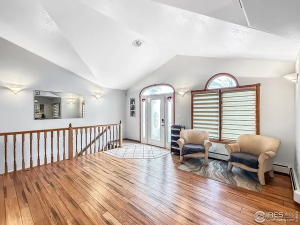 a view of livingroom with furniture and floor to ceiling window