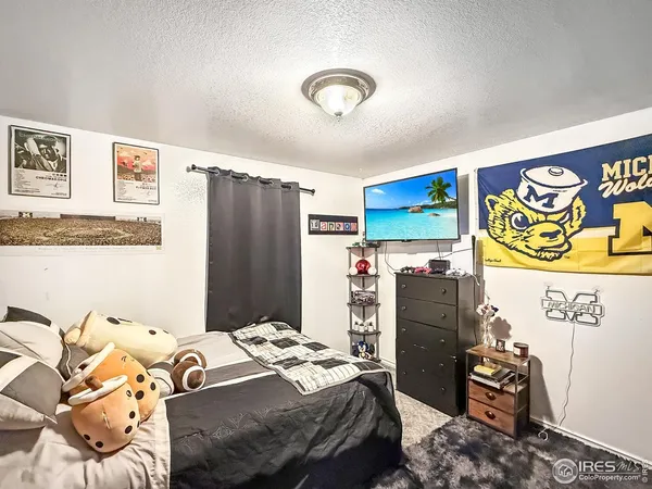 a bedroom with a bed and a table