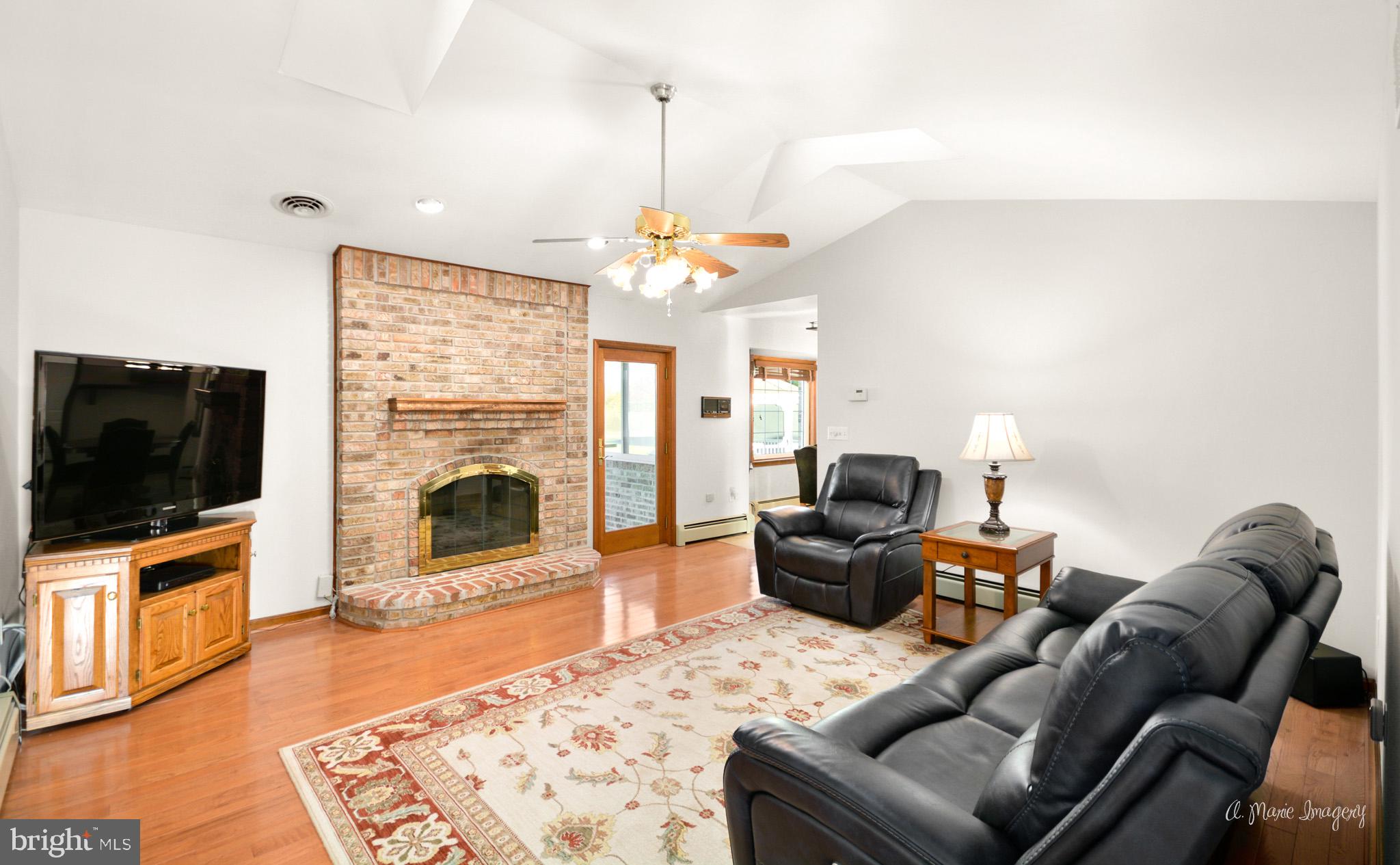 1944 John Shirk Road Taneytown, MD 21787 - Photo 21 of 59 Family room with skylights and masonry fireplace