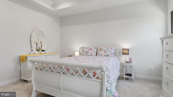 a bedroom with a bed and a sink