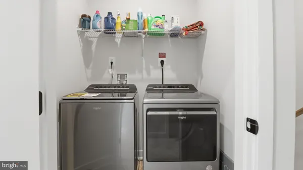a bedroom with a bed and cabinets