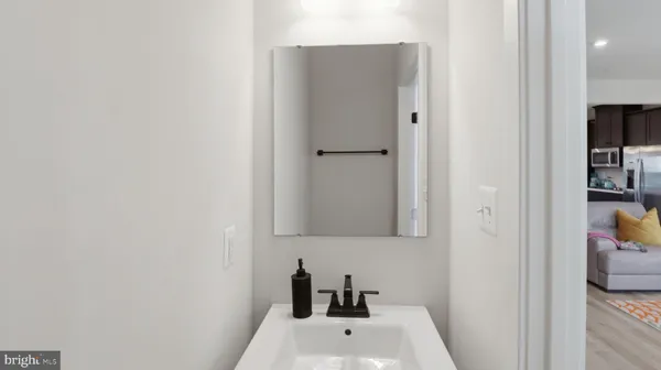 a white toilet sitting next to a sink