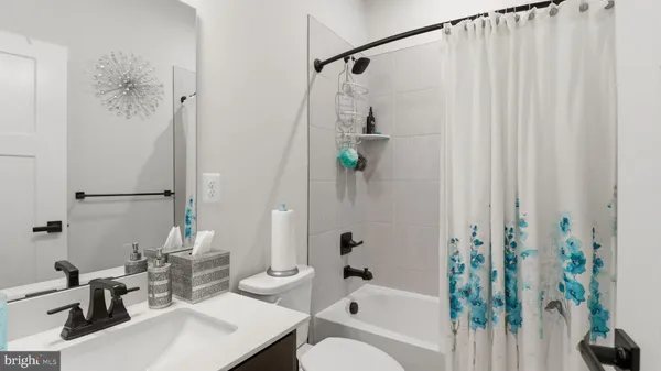 a bathroom with a sink and a window