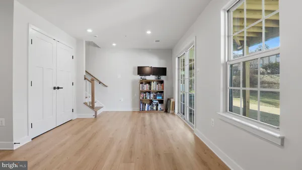 a view of staircase with white walls and a window