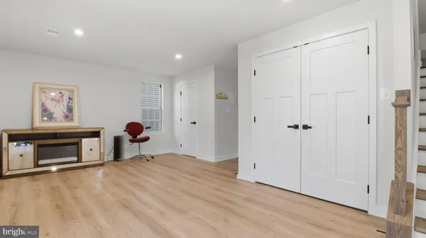 a room with furniture a window and flowerpot