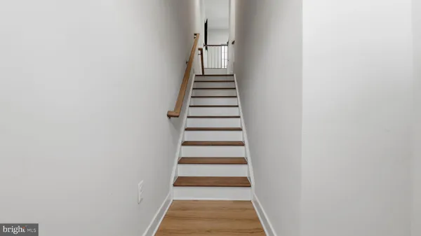 a view of a hallway with stairs