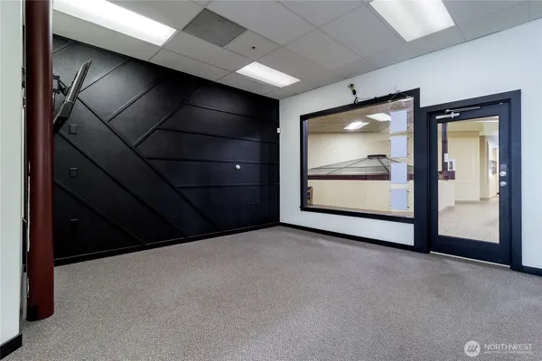 a view of an empty room with a window