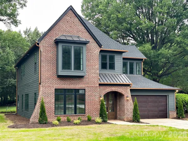 a front view of a house with yard