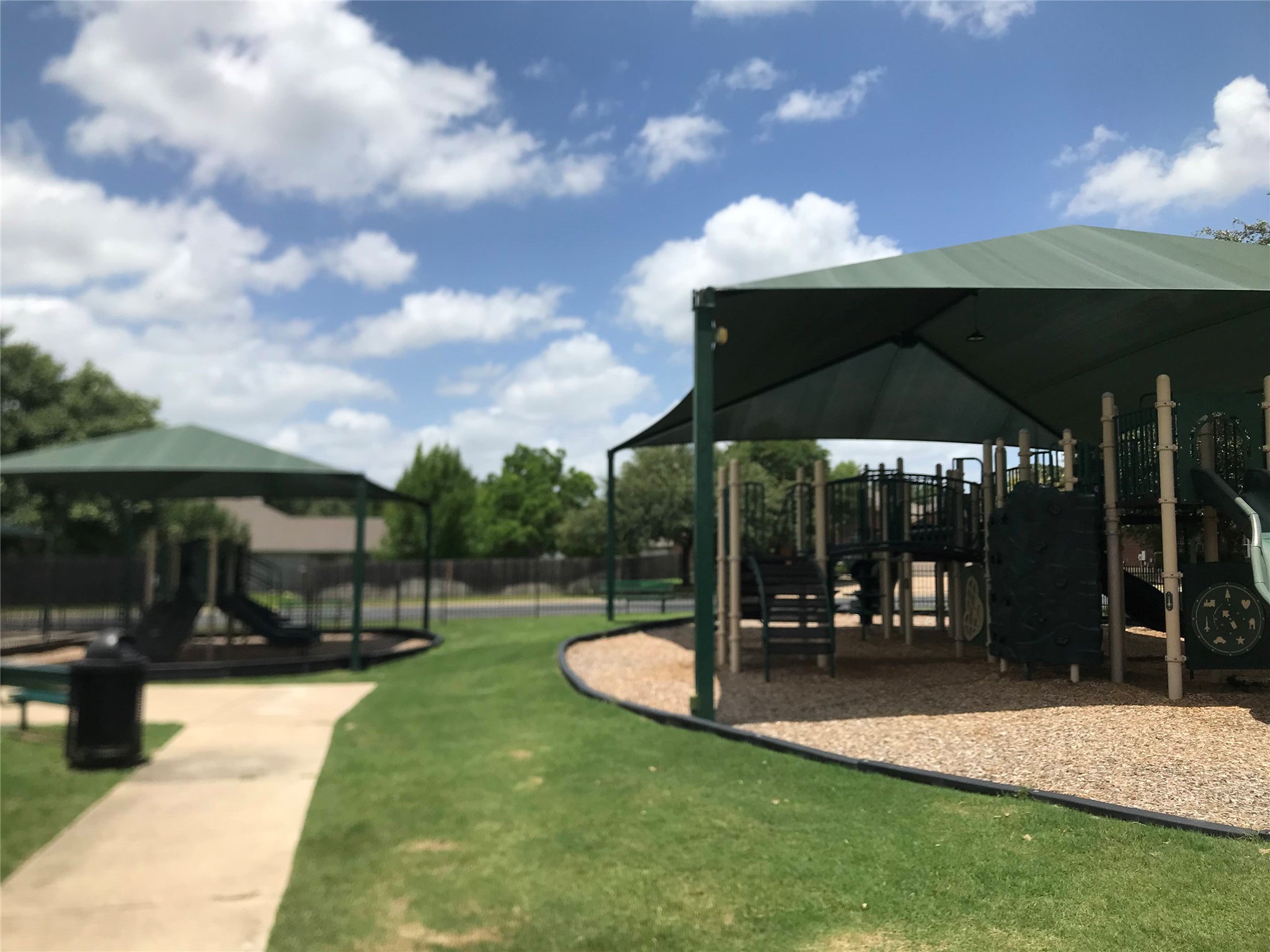 913 Rochester Castle Way Pflugerville, TX 78660 - Photo 23 of 25 A community playground features robust structures and ample shade, perfect for active enjoyment.