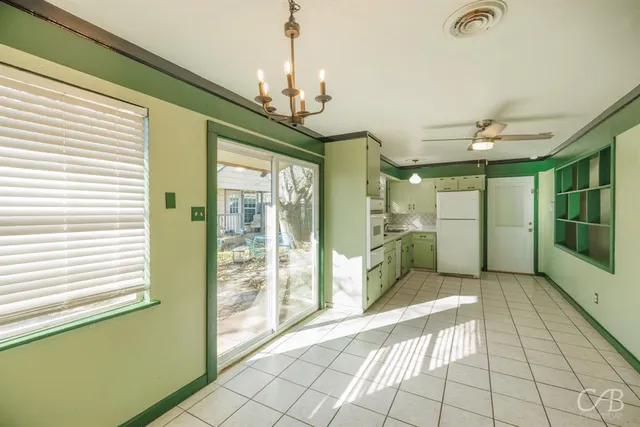 a view of a room with windows