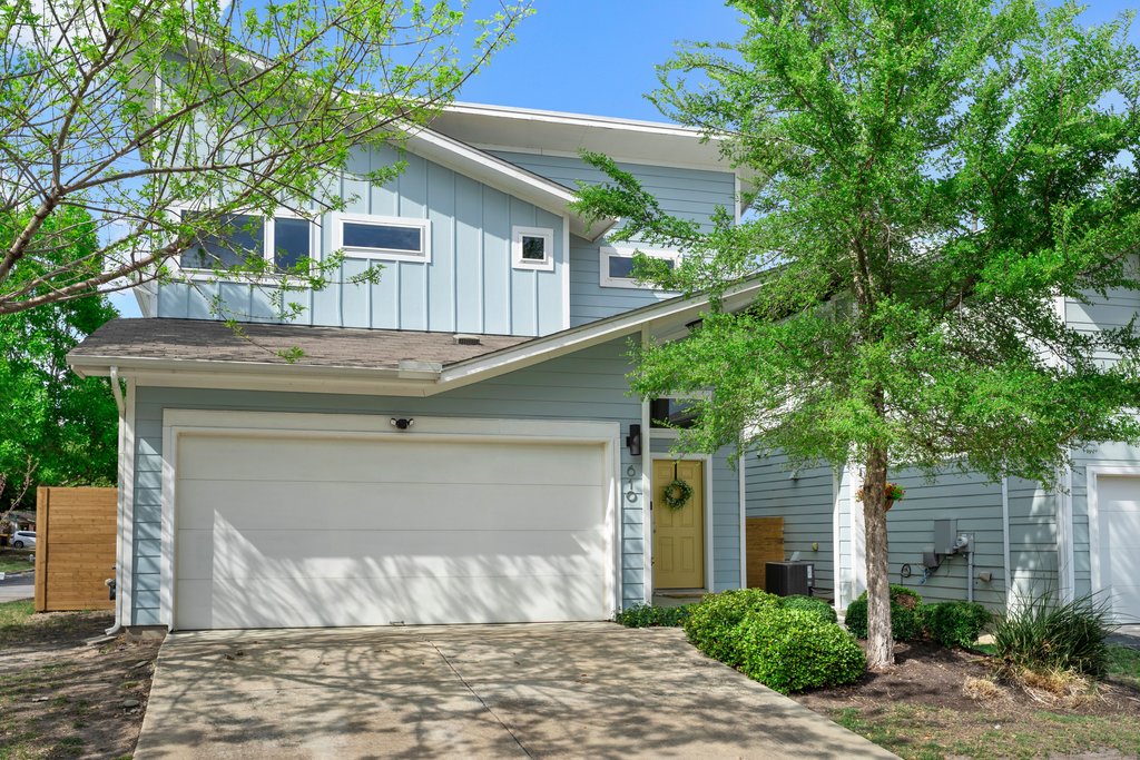 a front view of a house with a garage