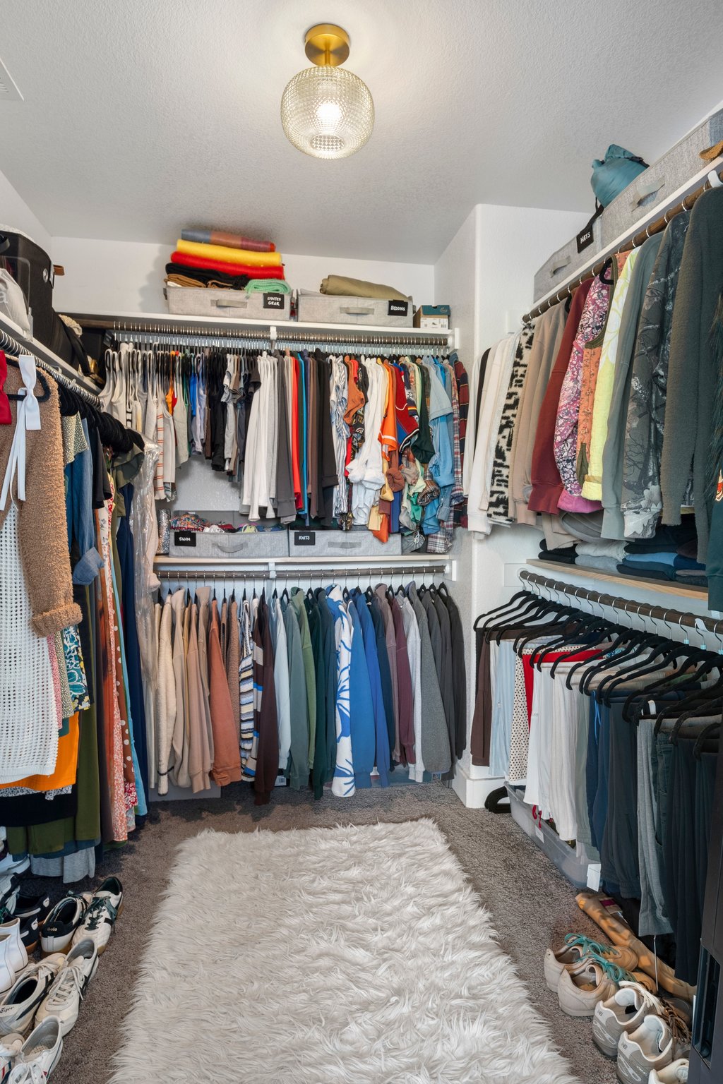 610 Bernstein Street, Unit 14 Austin, TX 78745 - Photo 22 of 39 a view of walk in closet with clothes shoes and a large mirror