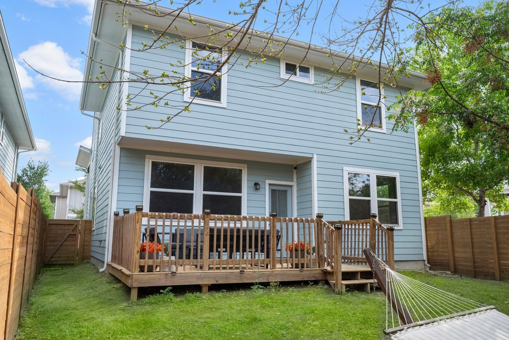 610 Bernstein Street, Unit 14 Austin, TX 78745 - Photo 33 of 39 a view of a house with a backyard and wooden fence