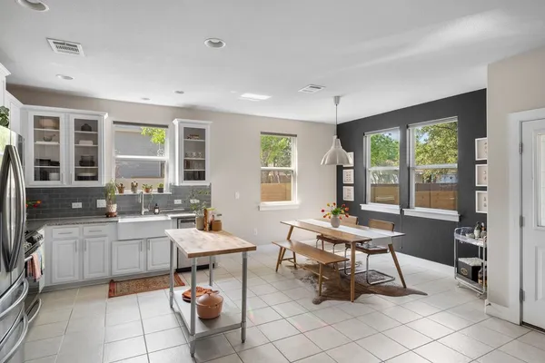 a kitchen with a sink and a stove top oven