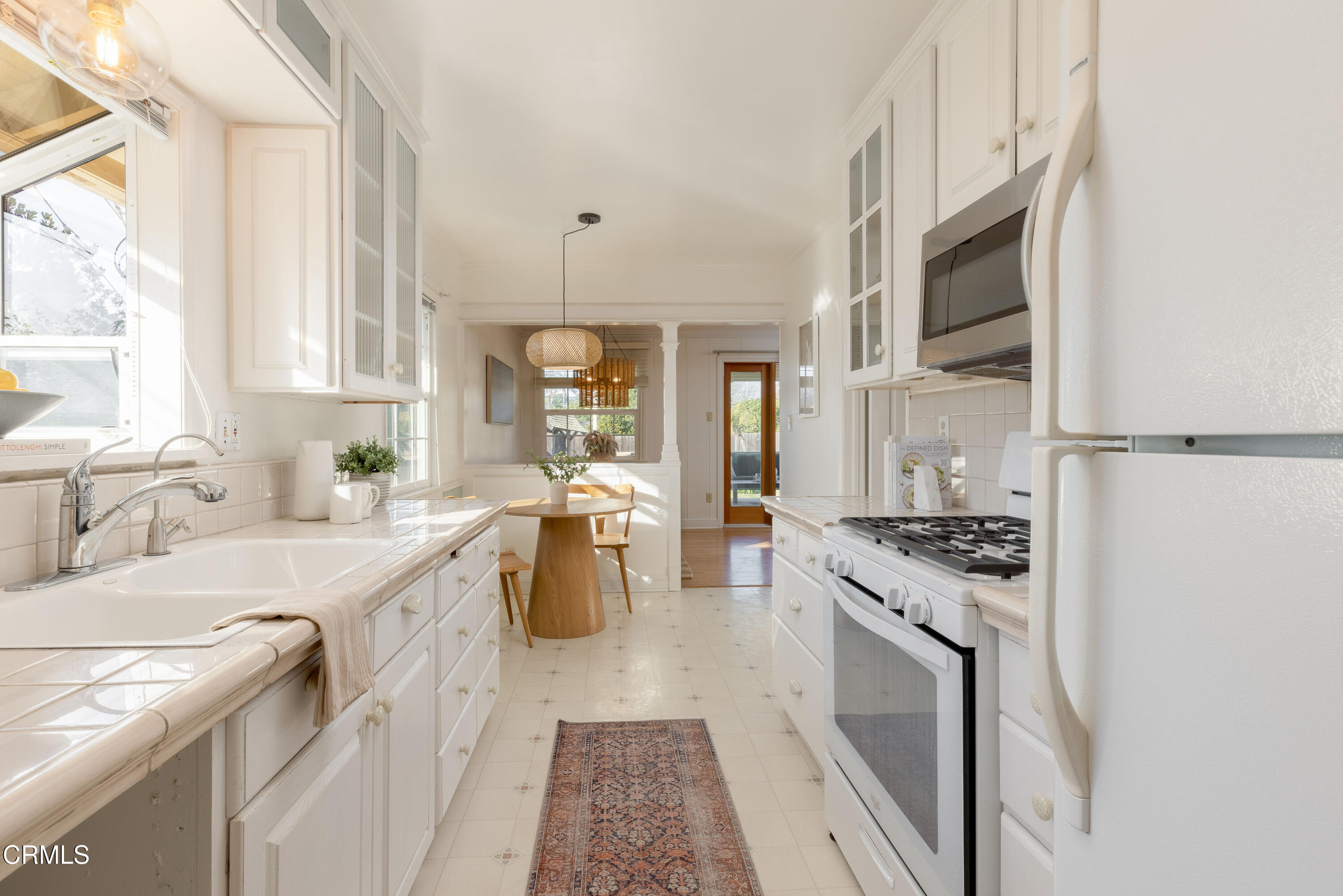 755 Calle Rey Mar Carpinteria, CA 93013 - Photo 8 of 18 a open kitchen with stainless steel appliances granite countertop a stove a sink and a refrigerator