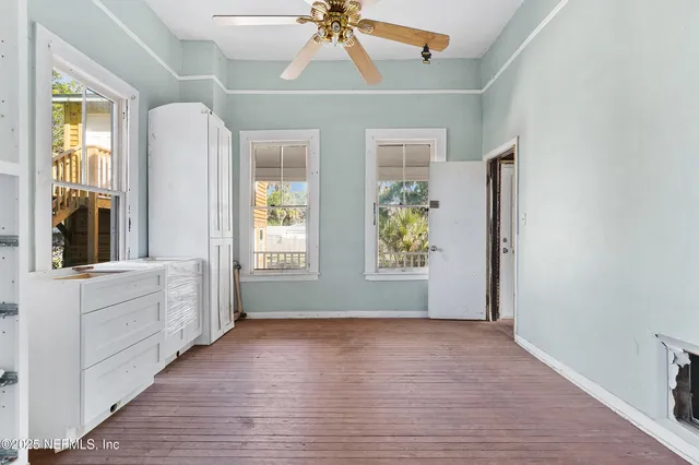 a view of room with window and hardwood floor