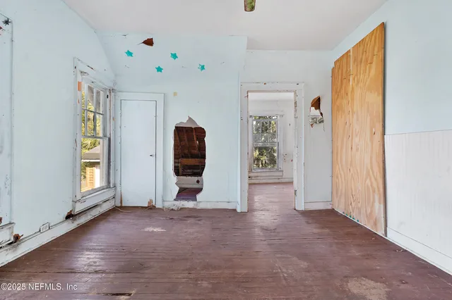 a view of an empty room with a window