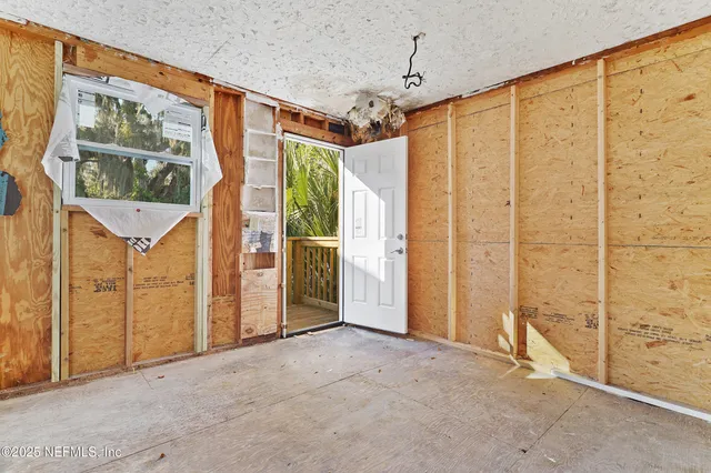 a view of a back yard from a room