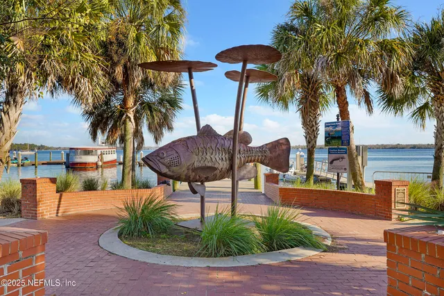 a view of outdoor space with dining table and chairs