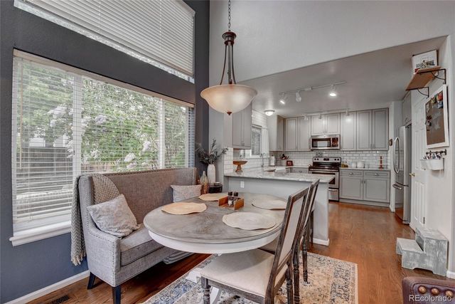 a dining room with furniture and window